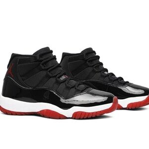 Air Jordan 11 Retro. Black/ Varsity Red/ White. Size 6.5 Men. 8 Women.